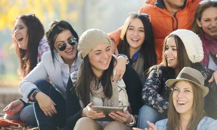 Happy teen girls having good fun time outdoors