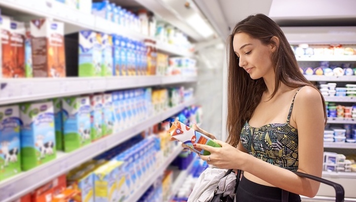 Women at grocery looking at product